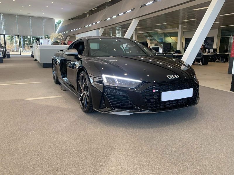 Audi R8 rental car parked