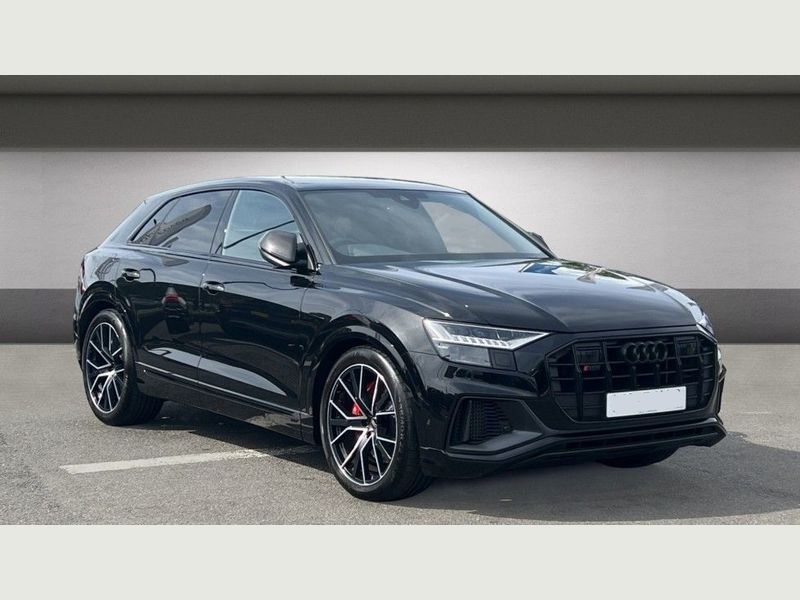 Sleek black Audi SQ7 viewed from the side.