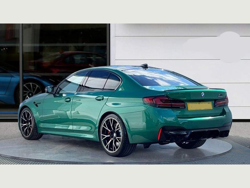 The rear view of the dynamic BMW M5 Series, highlighting its quad exhausts