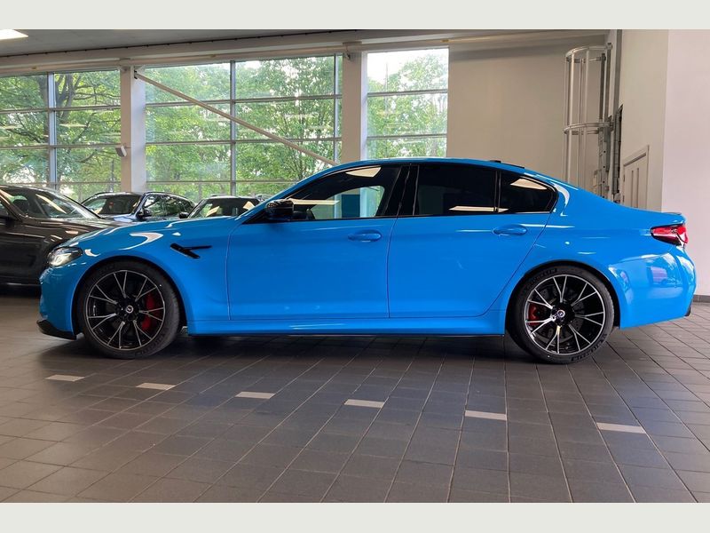 Side profile of a sleek BMW M5 Series parked