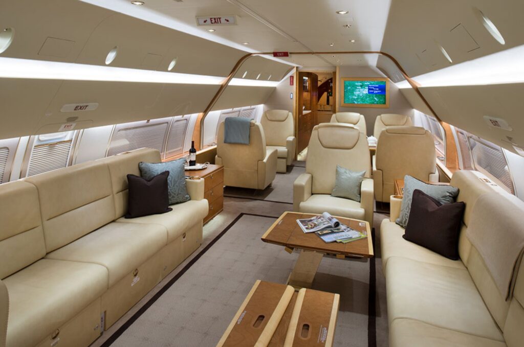 Elegant lounge area within a private charter BBJ