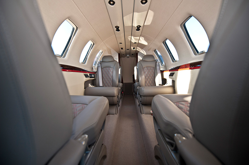 The spacious and luxurious interior cabin of the Citation CJ4 private jet.