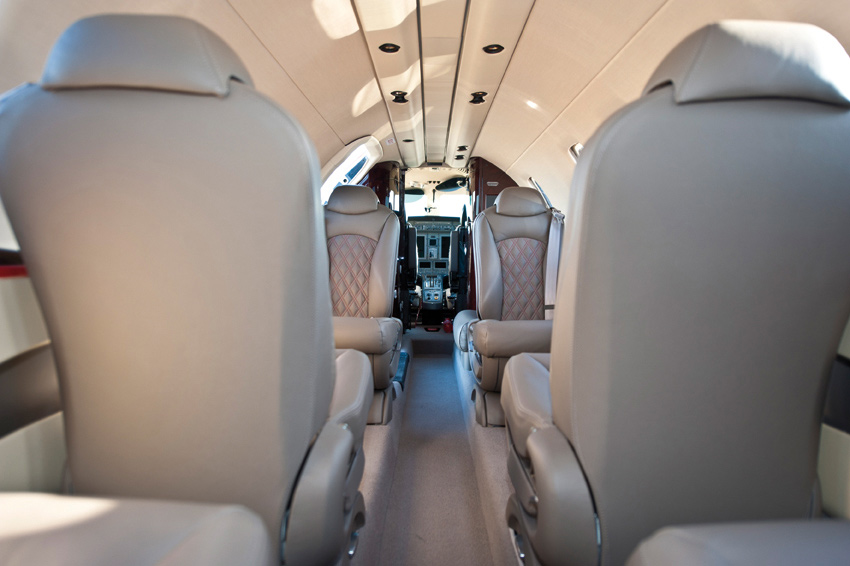 Close-up of the plush, cream leather seats inside a Citation CJ4.