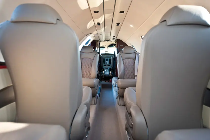 Close-up of the plush, cream leather seats inside a Citation CJ4.